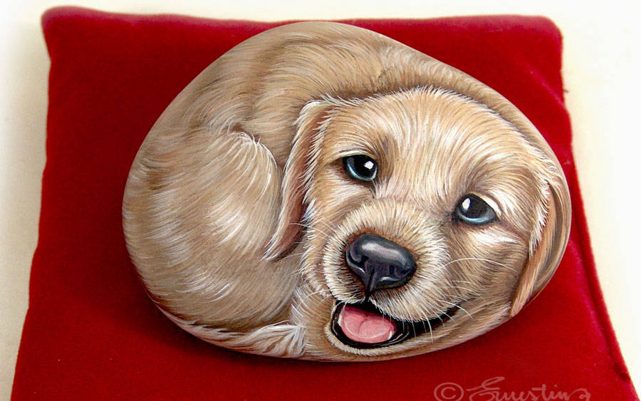 Ciottolo dipinto con cucciolo di cane